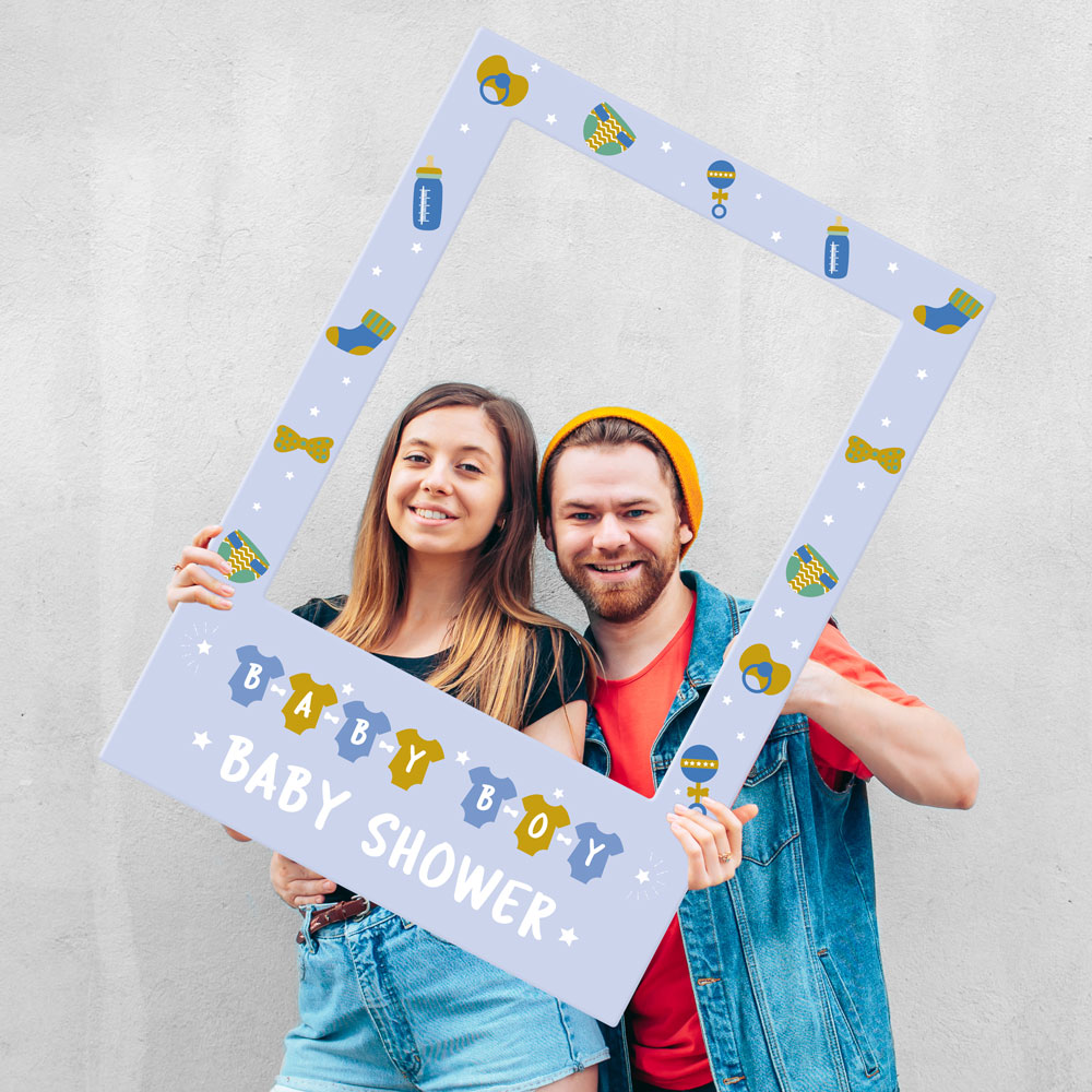 A Couple Holding a Selfie Frame